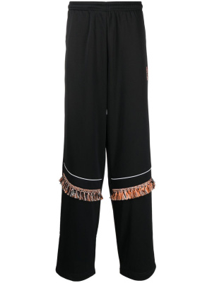 Fringe-detailing track pants, Marcelo Burlon County of Milan Fringe-detailing track pants
Fringe-detailing track pants, Marcelo Burlon County of Milan Fringe-detailing track pants