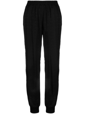 All over logo-print track trousers, Moschino All over logo-print track trousers
All over logo-print track trousers, Moschino All over logo-print track trousers