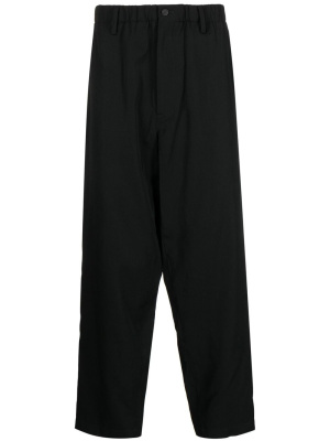 Elasticated-waist tapered-leg trousers, Yohji Yamamoto Elasticated-waist tapered-leg trousers
Elasticated-waist tapered-leg trousers, Yohji Yamamoto Elasticated-waist tapered-leg trousers