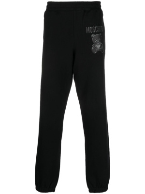 Logo-print organic cotton track pants, Moschino Logo-print organic cotton track pants
Logo-print organic cotton track pants, Moschino Logo-print organic cotton track pants