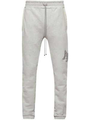 Logo-embroidered cotton track pants, AMIRI Logo-embroidered cotton track pants
Logo-embroidered cotton track pants, AMIRI Logo-embroidered cotton track pants