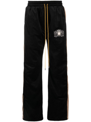 Crest-embroidered velvet track pants, Rhude Crest-embroidered velvet track pants
Crest-embroidered velvet track pants, Rhude Crest-embroidered velvet track pants