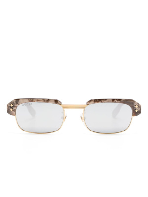 

Logo-embossed sunglasses, Gucci Eyewear Logo-embossed sunglasses