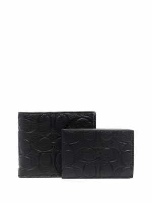

Logo-embossed bi-fold wallet, Coach Logo-embossed bi-fold wallet