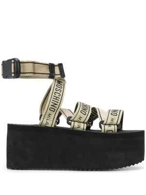 

Logo-strap platform sandals, Moschino Logo-strap platform sandals