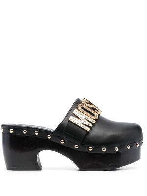 

Logo-plaque stud-embellished mules, Moschino Logo-plaque stud-embellished mules