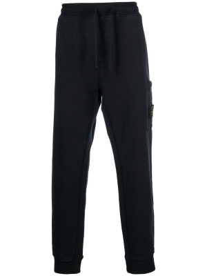 

Side logo-patch detail track pants, Stone Island Side logo-patch detail track pants