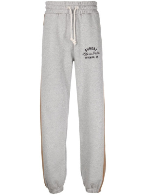 

Slogan-embroidered stripe-detail track pants, Palm Angels Slogan-embroidered stripe-detail track pants