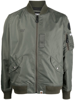 

URSUS BAPE logo-print bomber jacket, A BATHING APE® URSUS BAPE logo-print bomber jacket
