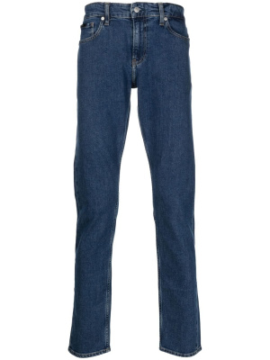 

Logo-patch slim-fit jeans, Calvin Klein Logo-patch slim-fit jeans