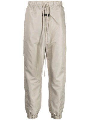 

Logo-patch drawstring track pants, FEAR OF GOD ESSENTIALS Logo-patch drawstring track pants