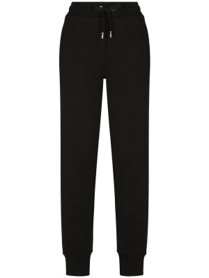 

Logo-embossed cotton track pants, Dolce & Gabbana Logo-embossed cotton track pants