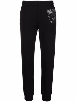 

Gem-embellished track pants, Moschino Gem-embellished track pants