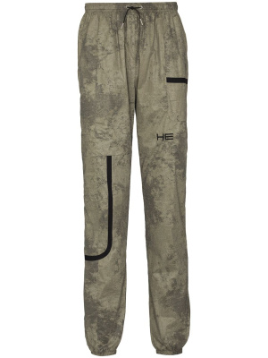 

Camouflage-print track pants, HELIOT EMIL Camouflage-print track pants