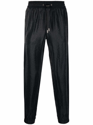 

Side-stripe tapered trousers, Saint Laurent Side-stripe tapered trousers