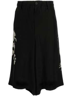

Graphic-print midi skirt, Yohji Yamamoto Graphic-print midi skirt