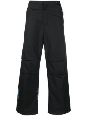 

Graphic-print trousers, Maharishi Graphic-print trousers