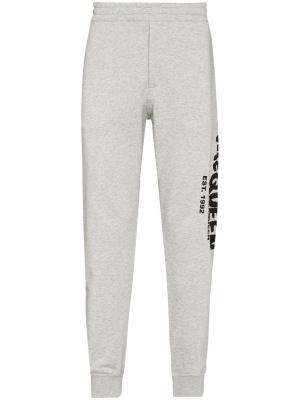 

Graffiti-print track pants, Alexander McQueen Graffiti-print track pants