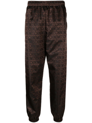 

All-over logo-print trousers, Moschino All-over logo-print trousers