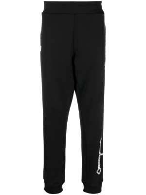 

Graphic-print organic-cotton track pants, Moschino Graphic-print organic-cotton track pants