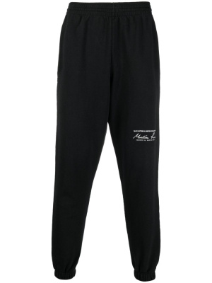

Logo-print slim-fit track pants, Martine Rose Logo-print slim-fit track pants