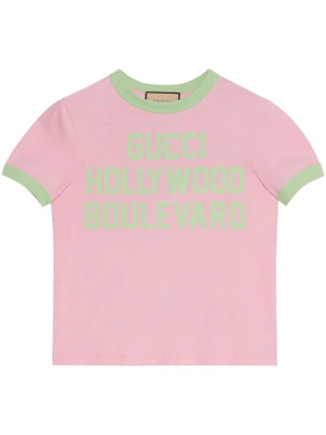 

Cropped flocked-slogan T-shirt, Gucci Cropped flocked-slogan T-shirt