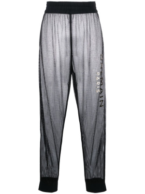 

Logo-print sheer mesh trousers, Balmain Logo-print sheer mesh trousers