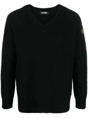 

Logo-patch V-neck jumper, Raf Simons Logo-patch V-neck jumper