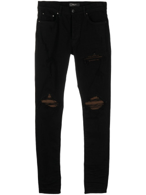 

Distressed ultra suede jeans, AMIRI Distressed ultra suede jeans