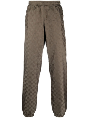 

Monogram-pattern trackpants, MISBHV Monogram-pattern trackpants