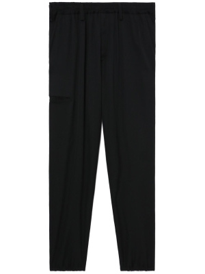 

Logo-patch wool trousers, Yohji Yamamoto Logo-patch wool trousers