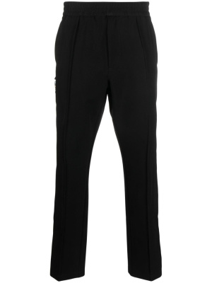 

Decorative buckle-detail tapered trousers, 1017 ALYX 9SM Decorative buckle-detail tapered trousers