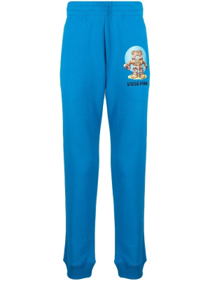 

Logo-print cotton track pants, Moschino Logo-print cotton track pants