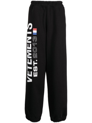 

Flag-logo print track pants, VETEMENTS Flag-logo print track pants