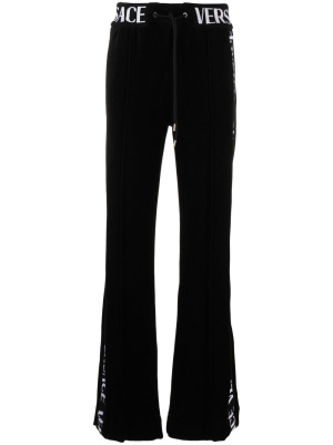 

Logo-lettering trousers, Versace Logo-lettering trousers