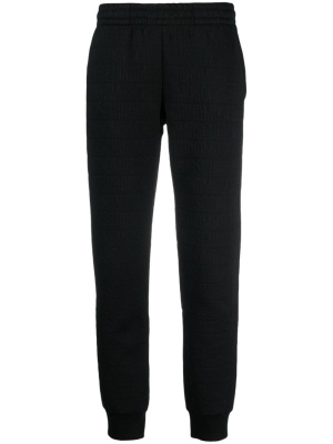 

Embossed-logo elasticated-waist track pants, Moschino Embossed-logo elasticated-waist track pants