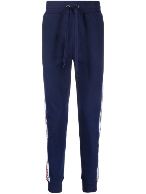 

Logo-tape detail stretch-cotton track pants, Moschino Logo-tape detail stretch-cotton track pants