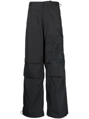 

Graphic-print wide-leg trousers, Maharishi Graphic-print wide-leg trousers