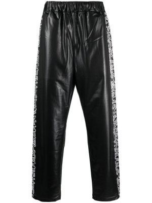 

Keith Haring tape-detailing track pants, Junya Watanabe Keith Haring tape-detailing track pants