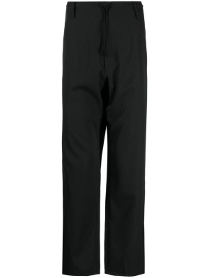 

Drawstring-waist logo-patch wool trousers, Yohji Yamamoto Drawstring-waist logo-patch wool trousers