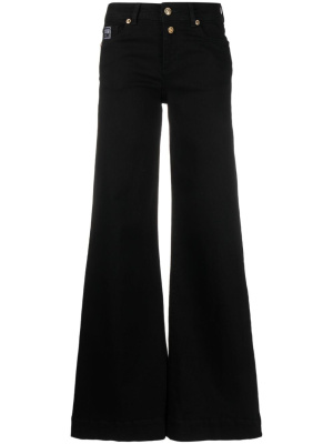 

Logo-appliqué flared jeans, Versace Jeans Couture Logo-appliqué flared jeans
