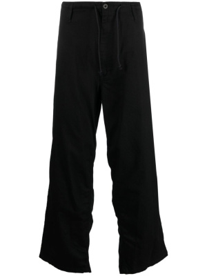 

Logo-tag cotton straight-leg trousers, Yohji Yamamoto Logo-tag cotton straight-leg trousers