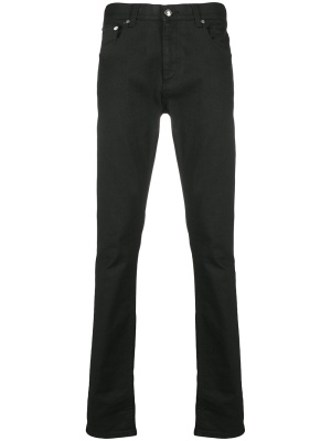 

Logo-studded slim-fit jeans, Alexander McQueen Logo-studded slim-fit jeans