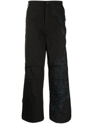 

Dragon-print straight trousers, Maharishi Dragon-print straight trousers
