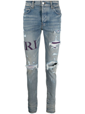 

Ripped-knee logo-print skinny jeans, AMIRI Ripped-knee logo-print skinny jeans