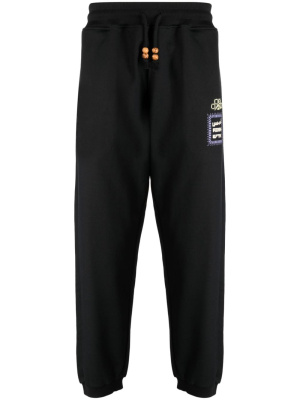 

Alkhws logo-print cotton track pants, Adish Alkhws logo-print cotton track pants